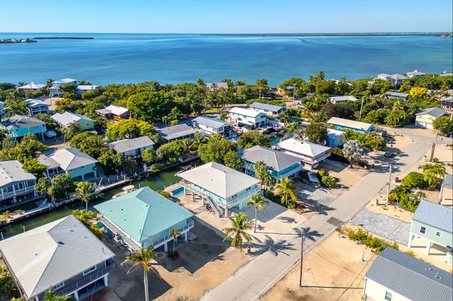 a view of a wooden deck next to a yard