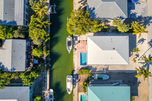 a view of a patio with wooden floor and outer view
