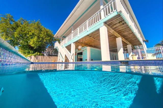 a view of house with outdoor space and seating area