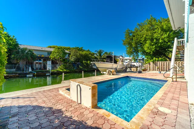 a bathroom with a sink mirror vanity and toilet