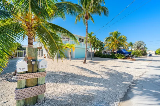 an aerial view of a house with outdoor space