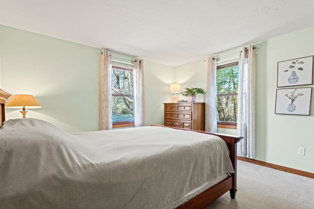 2 Heritage Way Bellingham, MA 02019 - Photo 20 of 31 a bedroom with a large bed and a window