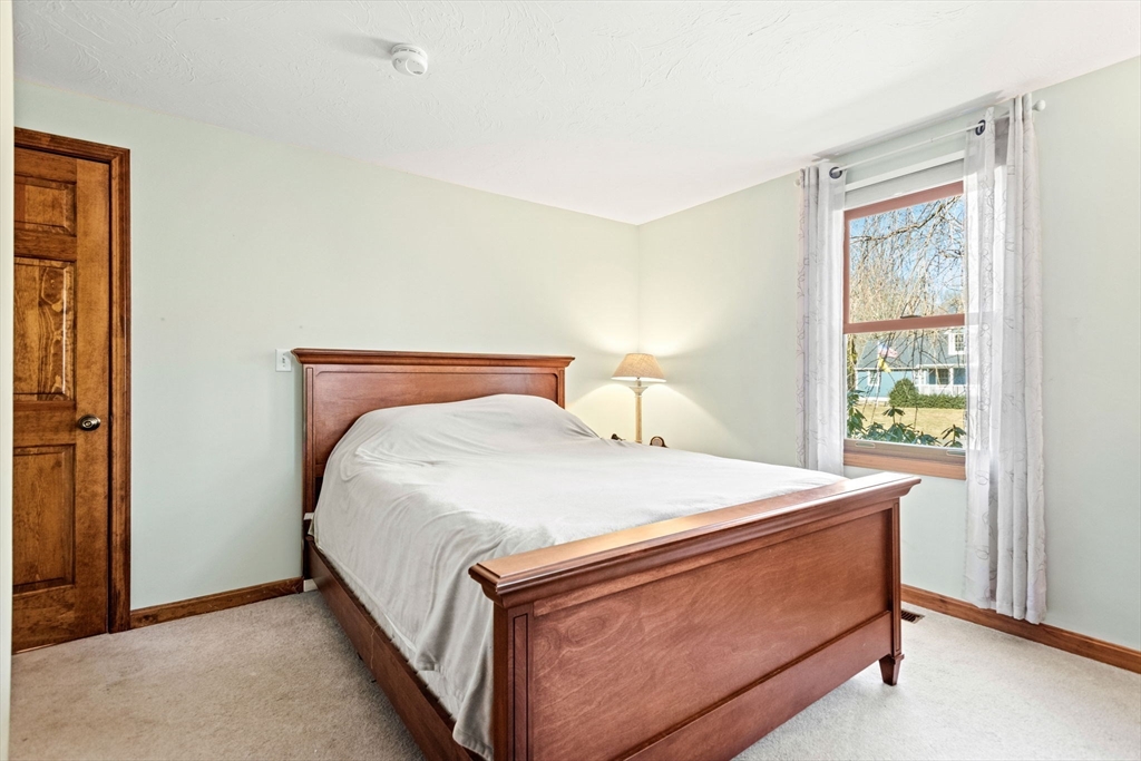 2 Heritage Way Bellingham, MA 02019 - Photo 21 of 31 a bed sitting in a bedroom next to a window