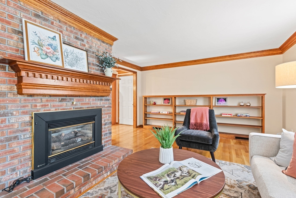 2 Heritage Way Bellingham, MA 02019 - Photo 3 of 31 a living room with furniture and a fireplace