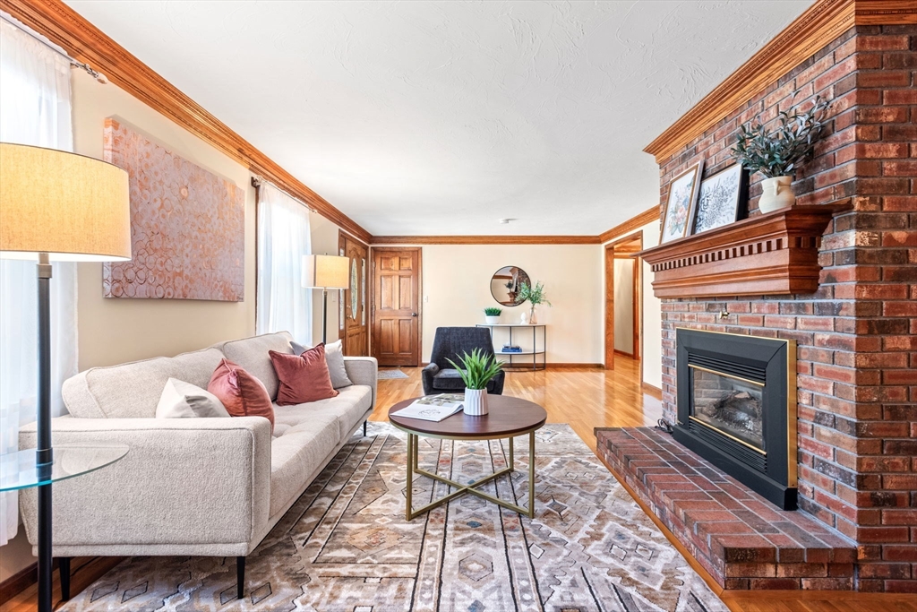 2 Heritage Way Bellingham, MA 02019 - Photo 5 of 31 a living room with furniture a window and a fireplace