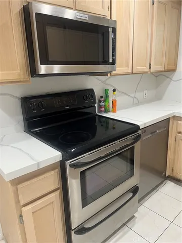 a kitchen with a stove and a microwave