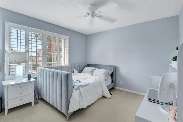 a bathroom with a granite countertop tub sink and shower
