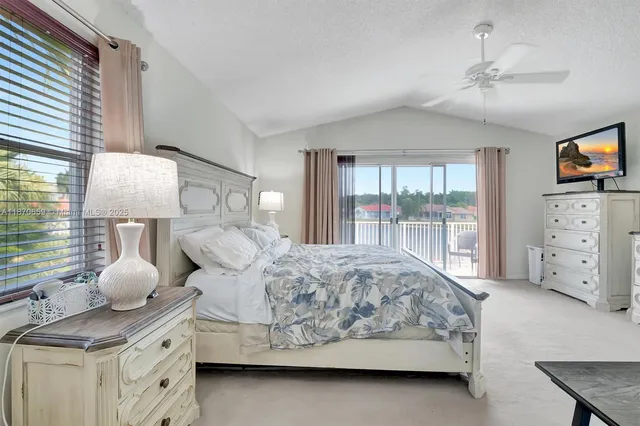 a view of a balcony with floor to ceiling windows
