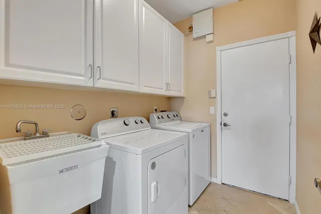 a view of a lake with houses in the background