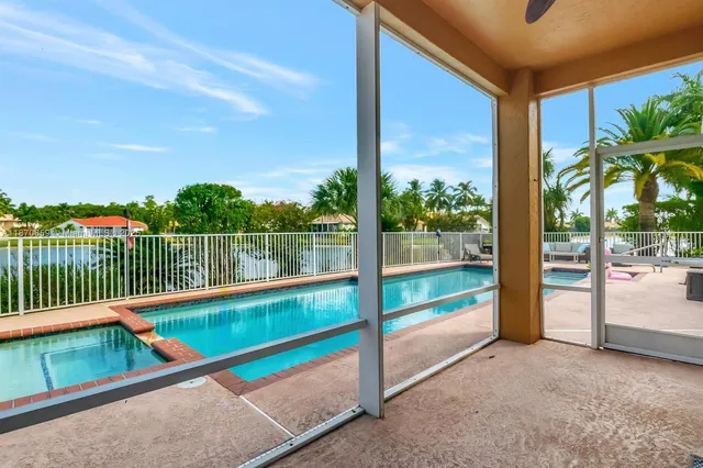 a front view of a house with a garden and plants