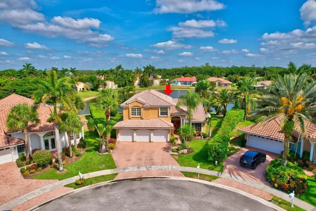 a work room with furniture and a potted plant