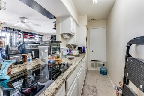 a kitchen with a stove and a refrigerator