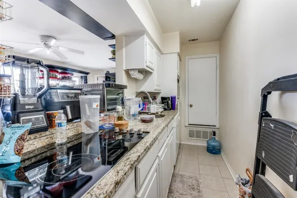 a kitchen with a stove and a refrigerator
