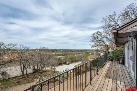 a view of balcony with furniture