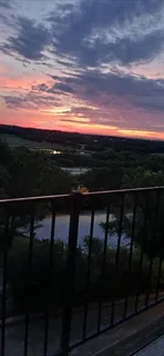 a view of balcony with two chairs