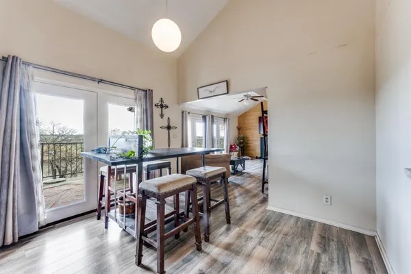 a view of a dining room with furniture window and wooden floor