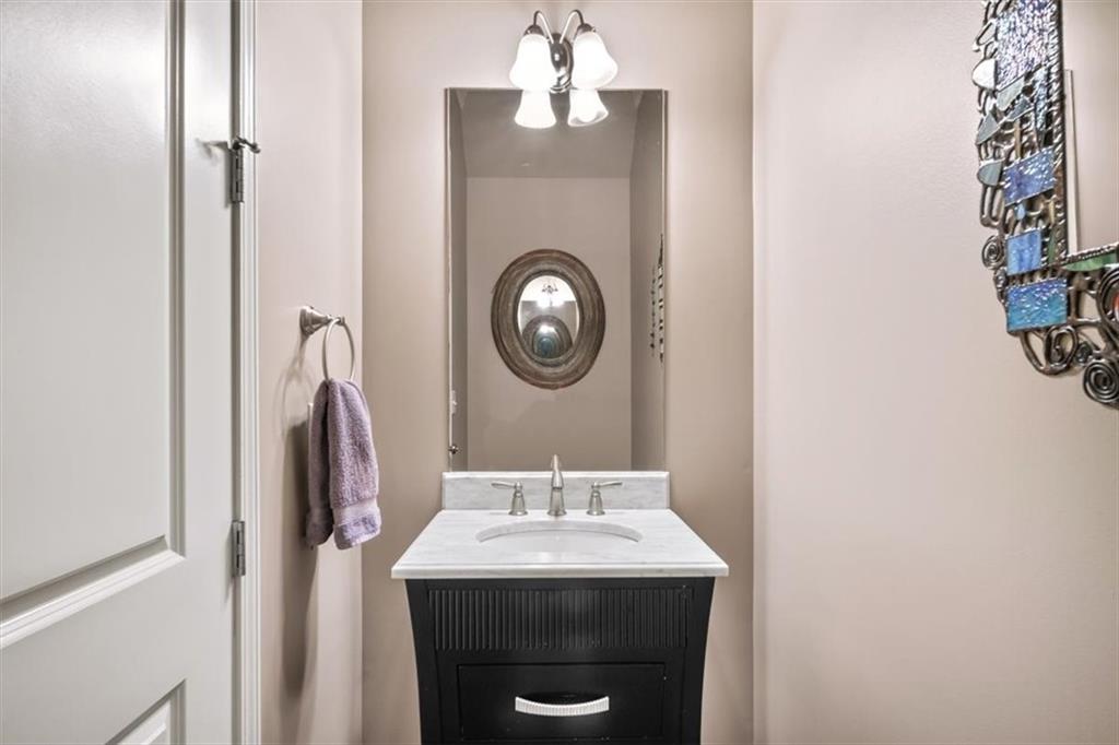 5564 High Point Road Northeast Atlanta, GA 30342 - Photo 17 of 45 a bathroom with a sink and a mirror