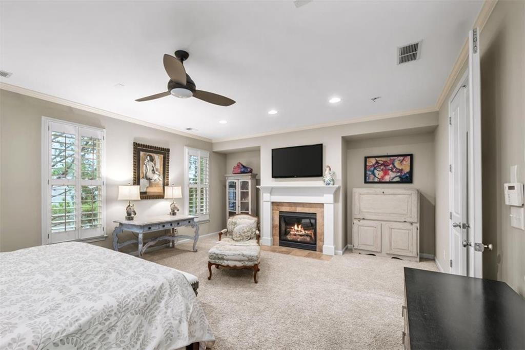 5564 High Point Road Northeast Atlanta, GA 30342 - Photo 22 of 45 a bed room with furniture and a fireplace