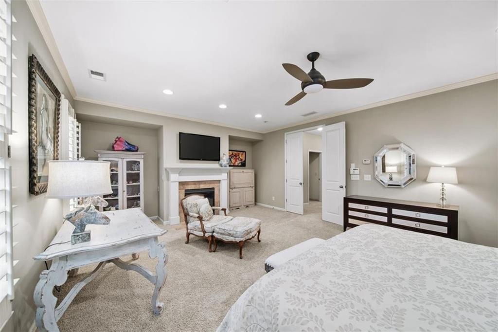 5564 High Point Road Northeast Atlanta, GA 30342 - Photo 23 of 45 a living room with furniture a fireplace and a flat screen tv