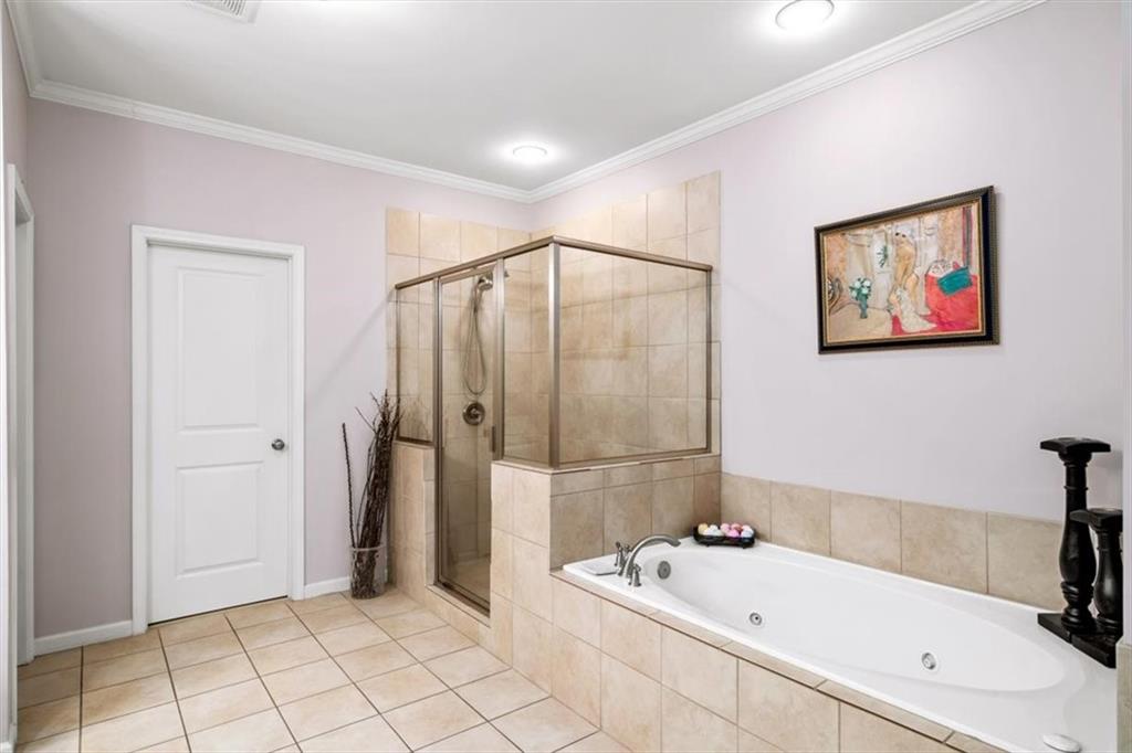 5564 High Point Road Northeast Atlanta, GA 30342 - Photo 25 of 45 a bathroom with a bathtub and a shower