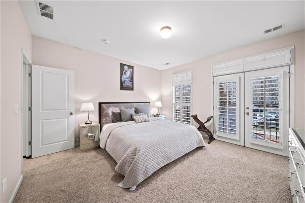 5564 High Point Road Northeast Atlanta, GA 30342 - Photo 27 of 45 a bedroom with a bed and a large window