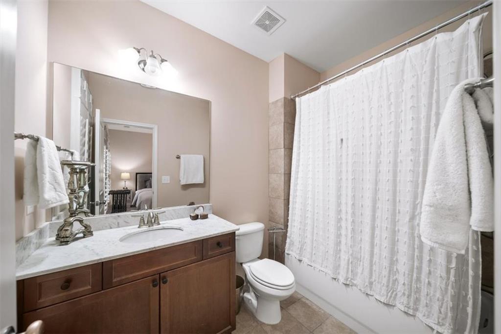 5564 High Point Road Northeast Atlanta, GA 30342 - Photo 29 of 45 a bathroom with a double vanity sink mirror and toilet
