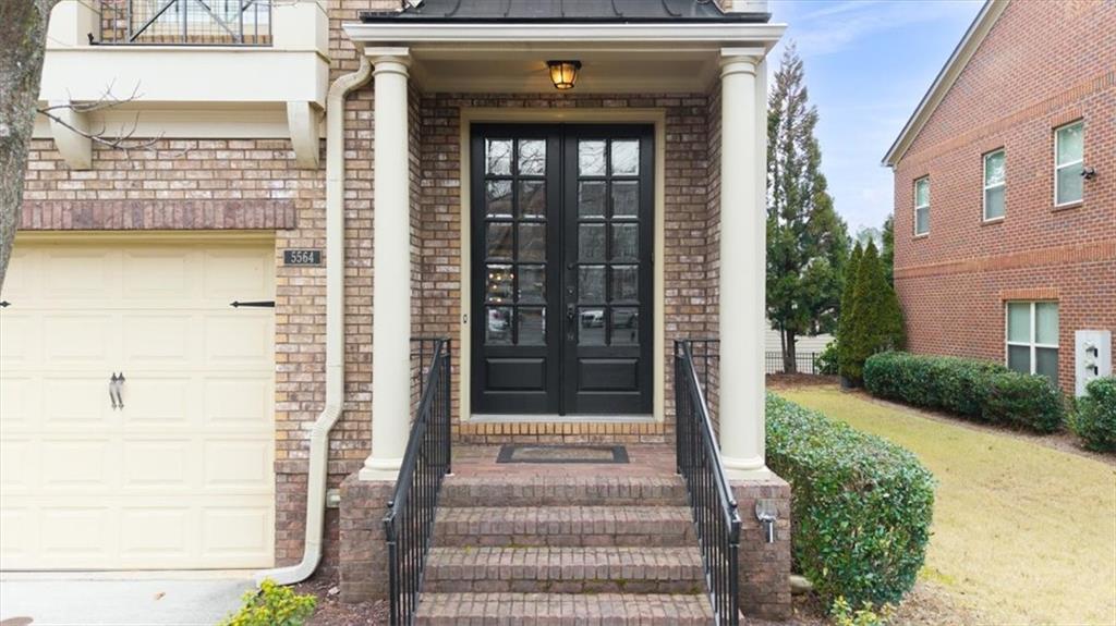 5564 High Point Road Northeast Atlanta, GA 30342 - Photo 3 of 45 a front view of a house with a garden