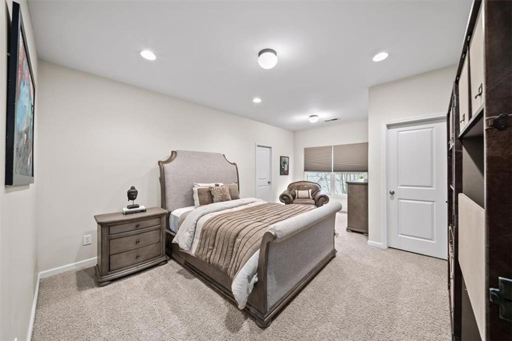 5564 High Point Road Northeast Atlanta, GA 30342 - Photo 31 of 45 a room with a bed and a cabinets