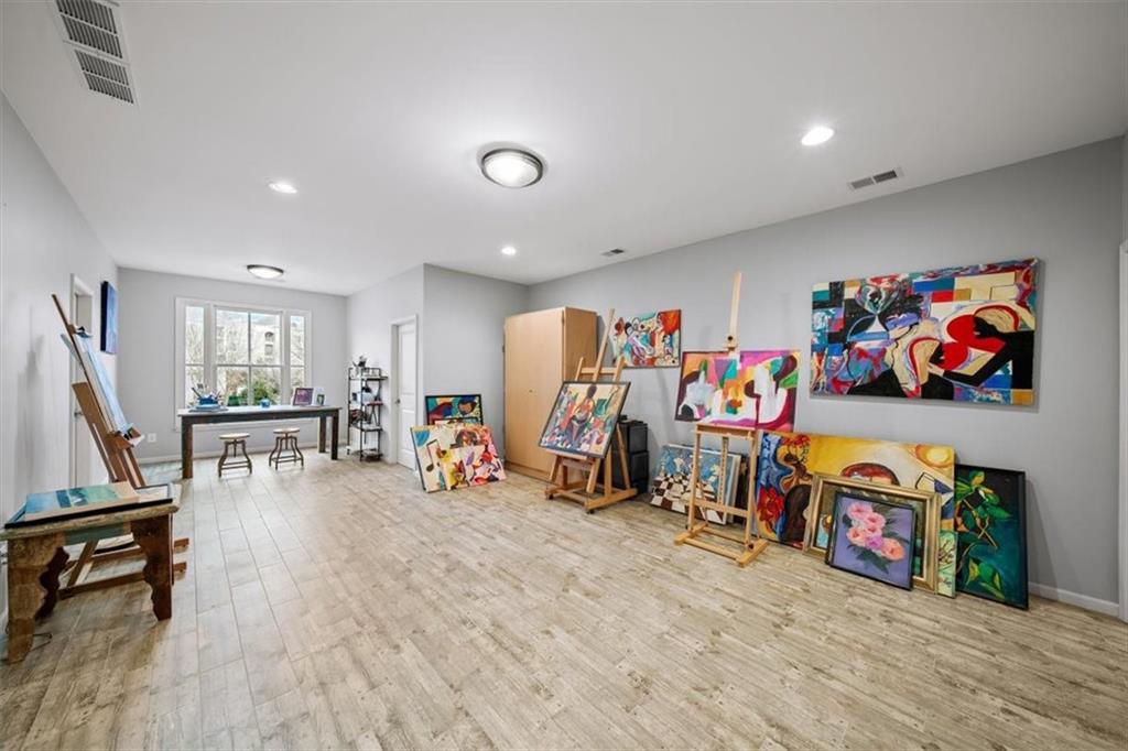 5564 High Point Road Northeast Atlanta, GA 30342 - Photo 34 of 45 a view of a play room with furniture and wooden floor