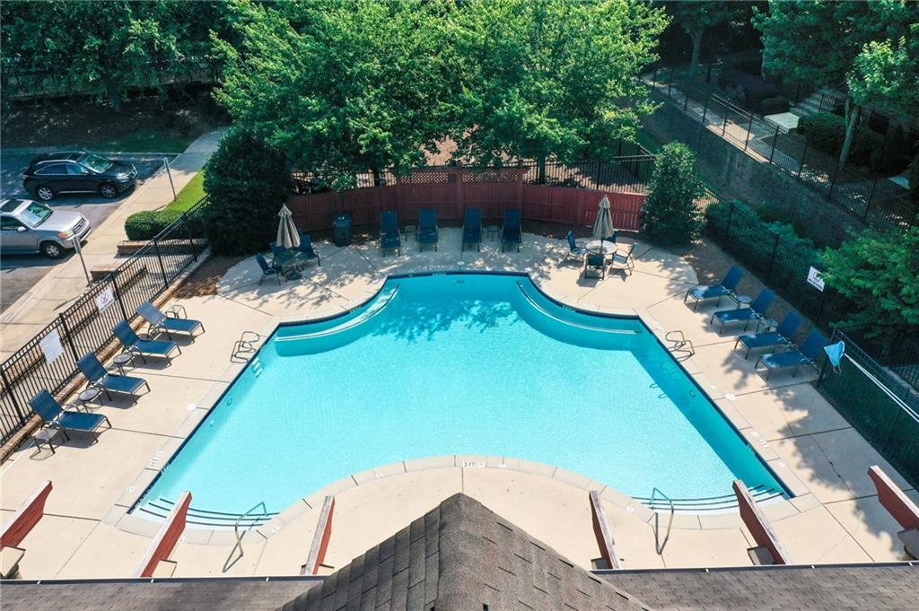 5564 High Point Road Northeast Atlanta, GA 30342 - Photo 36 of 45 a view of a swimming pool with a patio and a yard
