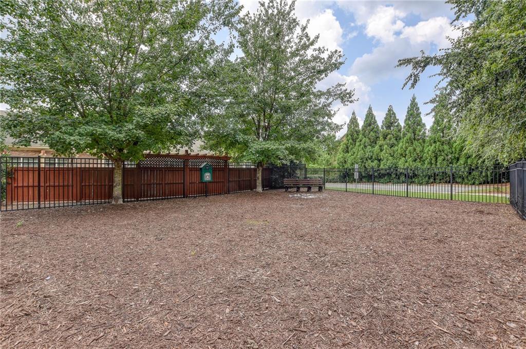 5564 High Point Road Northeast Atlanta, GA 30342 - Photo 43 of 45 a view of a backyard with large trees and wooden fence