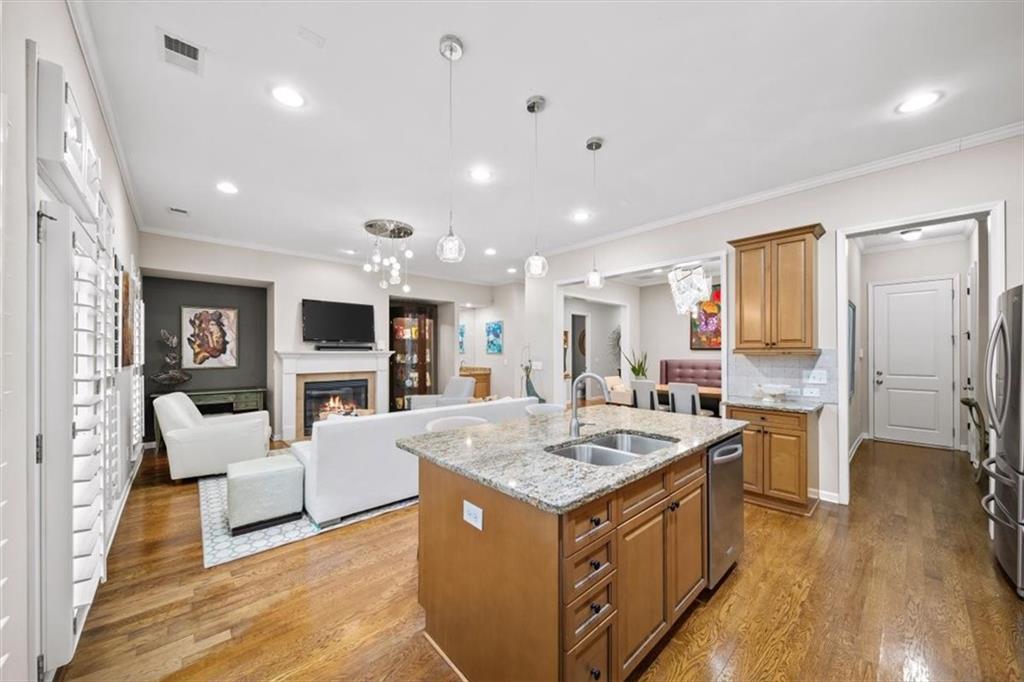 5564 High Point Road Northeast Atlanta, GA 30342 - Photo 10 of 45 a large kitchen with kitchen island a sink appliances and a counter space