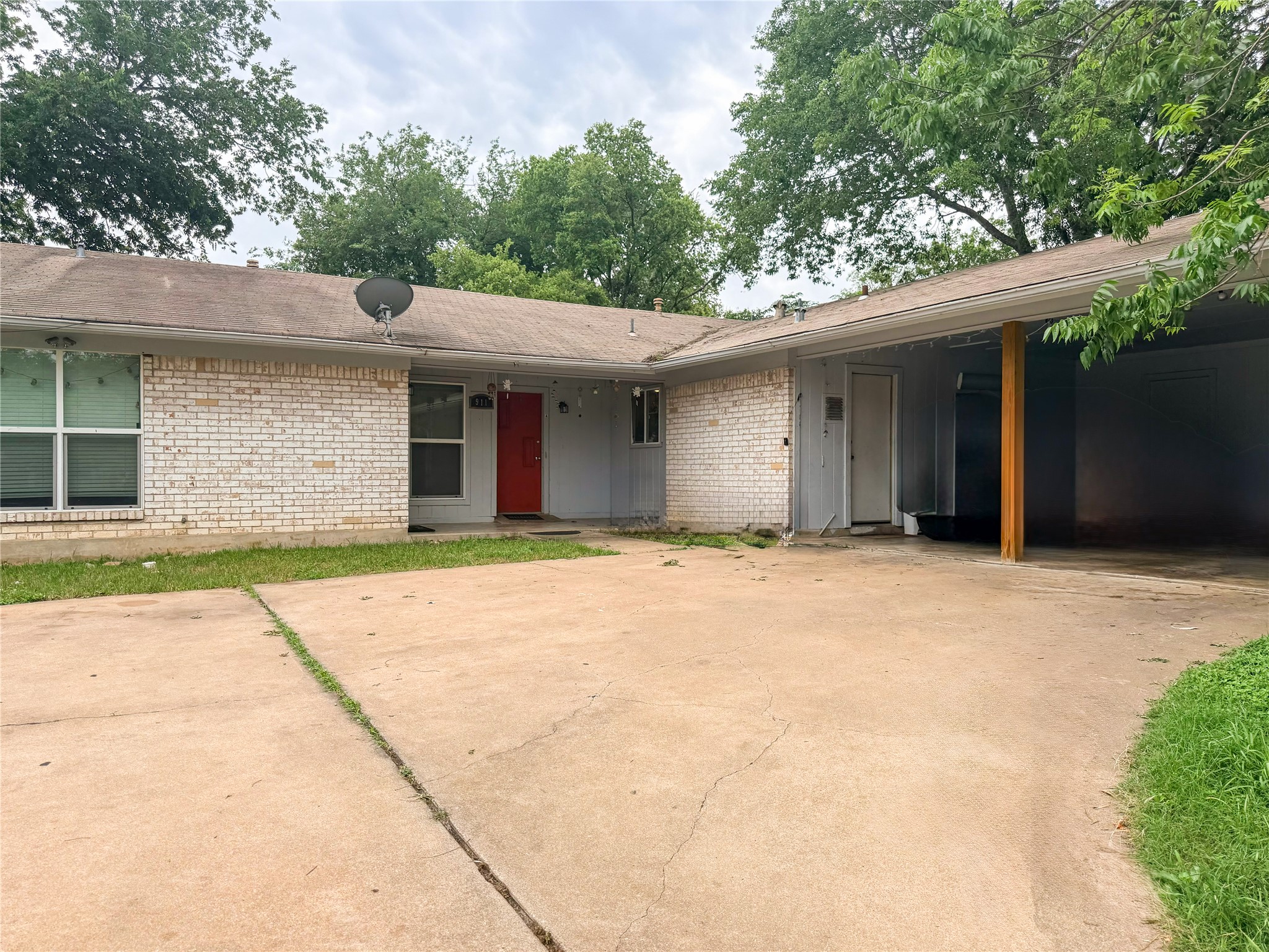 911 Kirschner Place, Unit A Austin, TX 78758 - Photo 4 of 12 One carport space is for Unit A. There is additional storage in the carport.