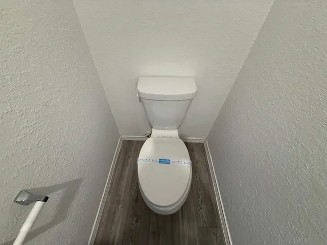 a bathroom with a toilet and a sink