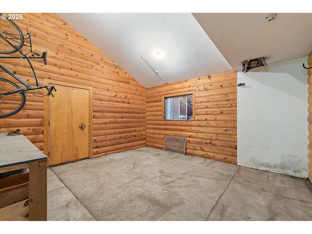 a view of a yard with red brick wall