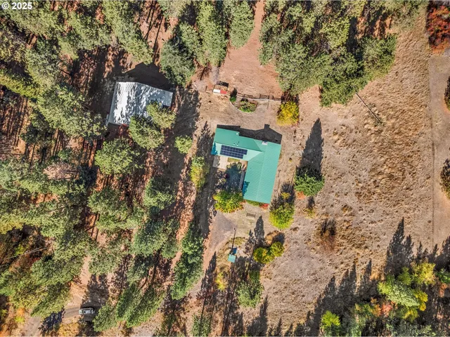 an aerial view of residential house with outdoor space