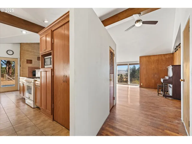 a open kitchen with stainless steel appliances granite countertop a refrigerator and a sink