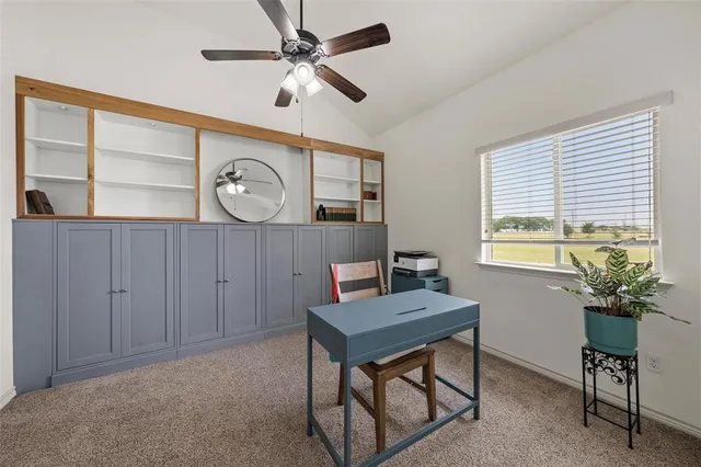 a workspace with furniture and a window