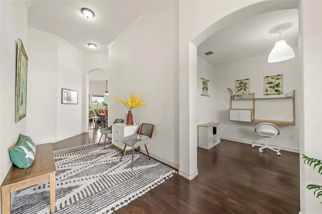 a living room with furniture and a table