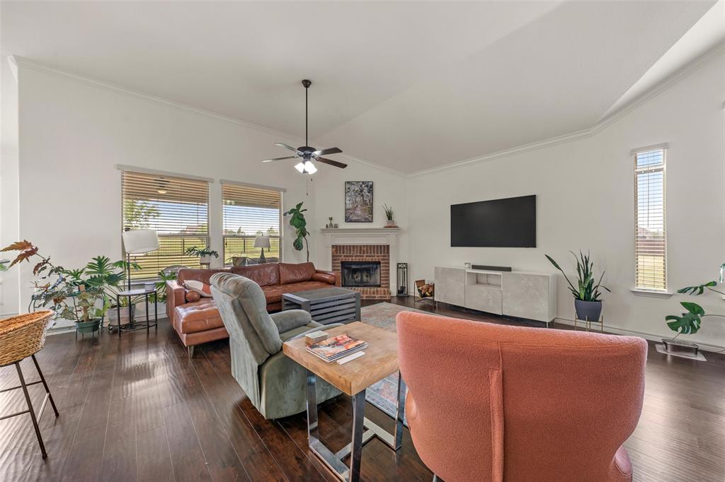 4756 Old Lorena Road Lorena, TX 76655 - Photo 7 of 39 a living room with furniture a flat screen tv and a fireplace