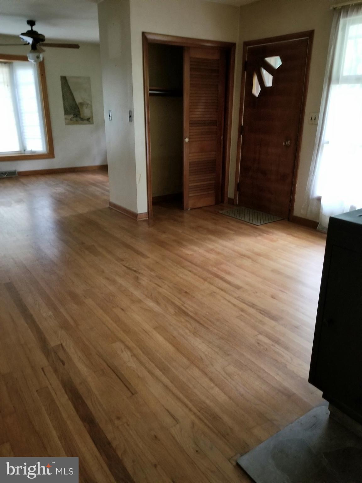 2548 Roop Road Keymar, MD 21757 - Photo 22 of 33 an empty room with wooden floor and windows