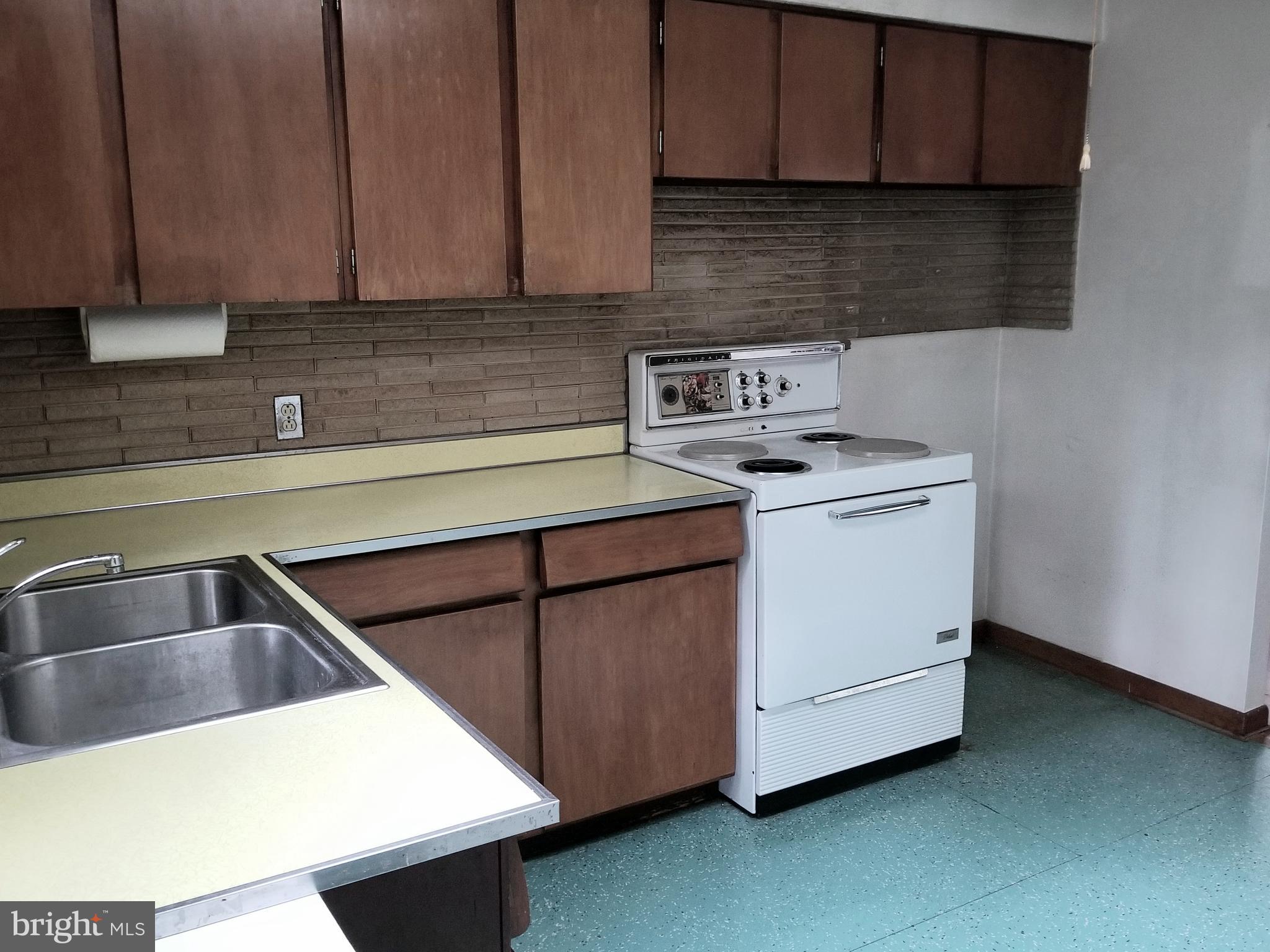 2548 Roop Road Keymar, MD 21757 - Photo 5 of 33 a kitchen with a sink cabinets and utility