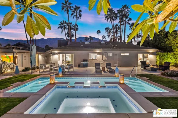 a view of a yard with swimming pool table and chairs