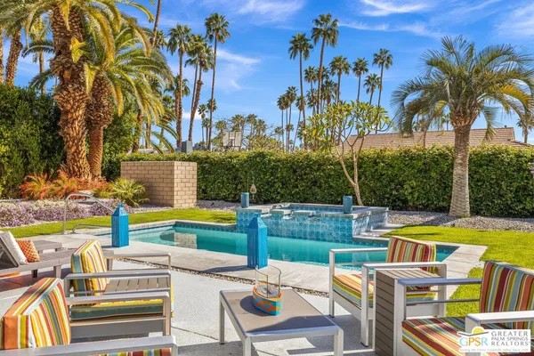 a view of a swimming pool with a lounge chairs