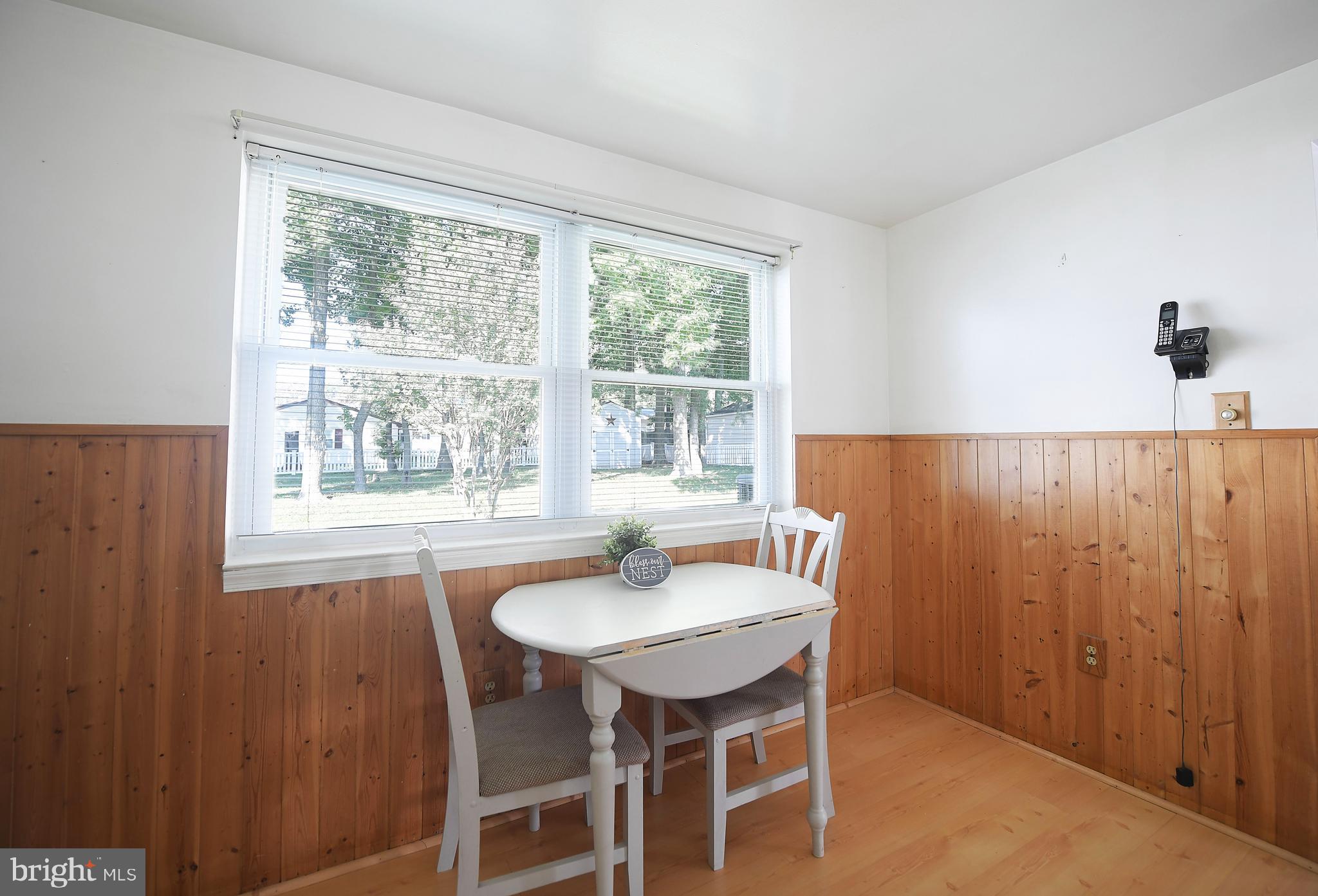 2400 Maple Road Baltimore, MD 21219 - Photo 21 of 45 a dining room with furniture and window