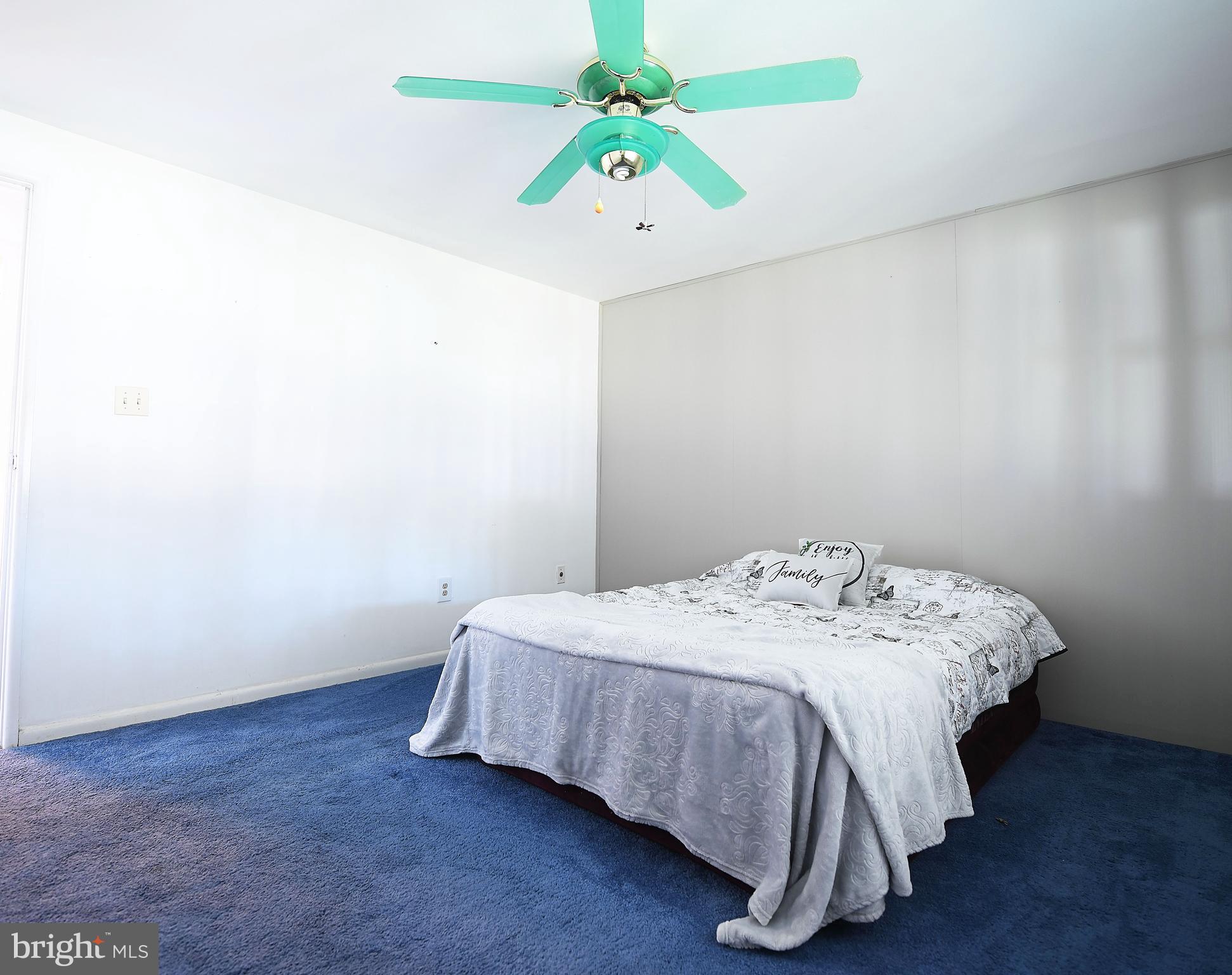 2400 Maple Road Baltimore, MD 21219 - Photo 23 of 45 a bedroom with a bed and a chandelier