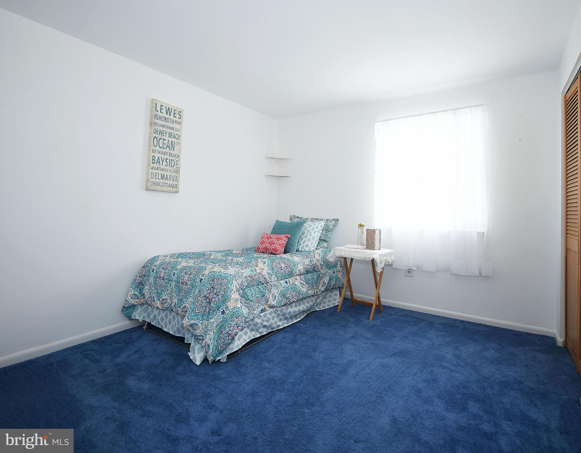 2400 Maple Road Baltimore, MD 21219 - Photo 28 of 45 a bedroom with a bed and a window
