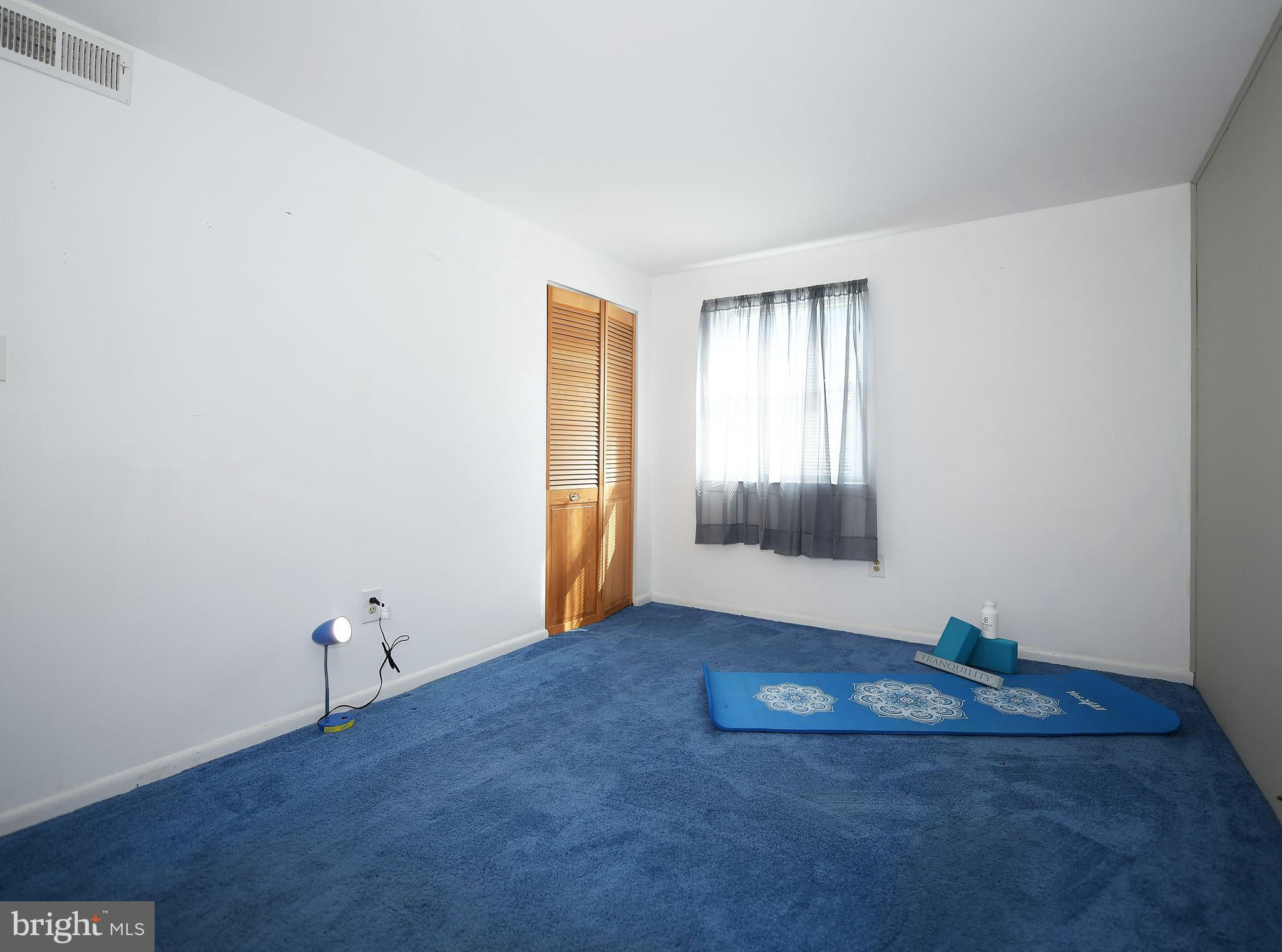 2400 Maple Road Baltimore, MD 21219 - Photo 30 of 45 a view of an empty room with wooden floor and a window