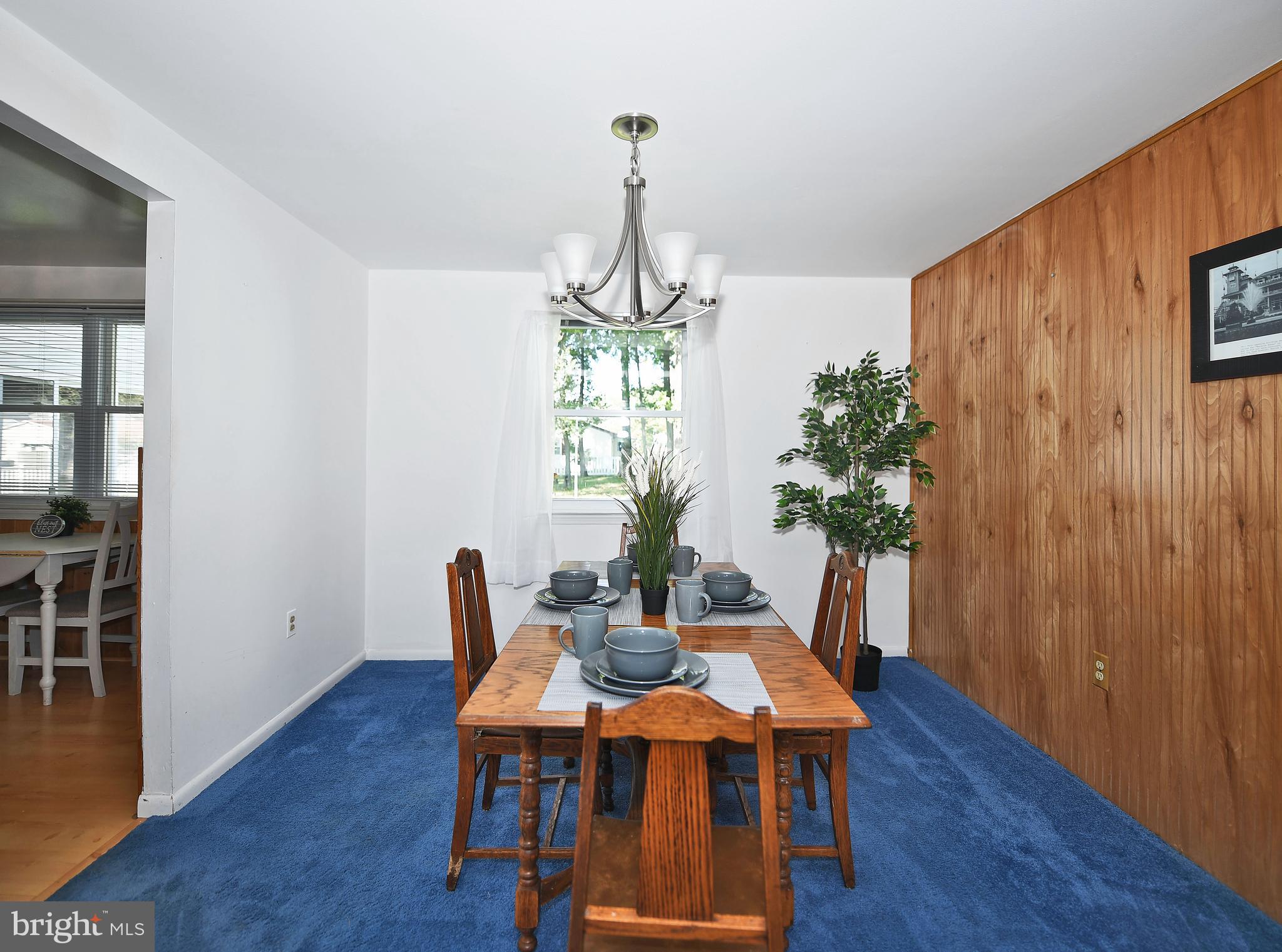 2400 Maple Road Baltimore, MD 21219 - Photo 7 of 45 a view of a dining room with furniture window and wooden floor