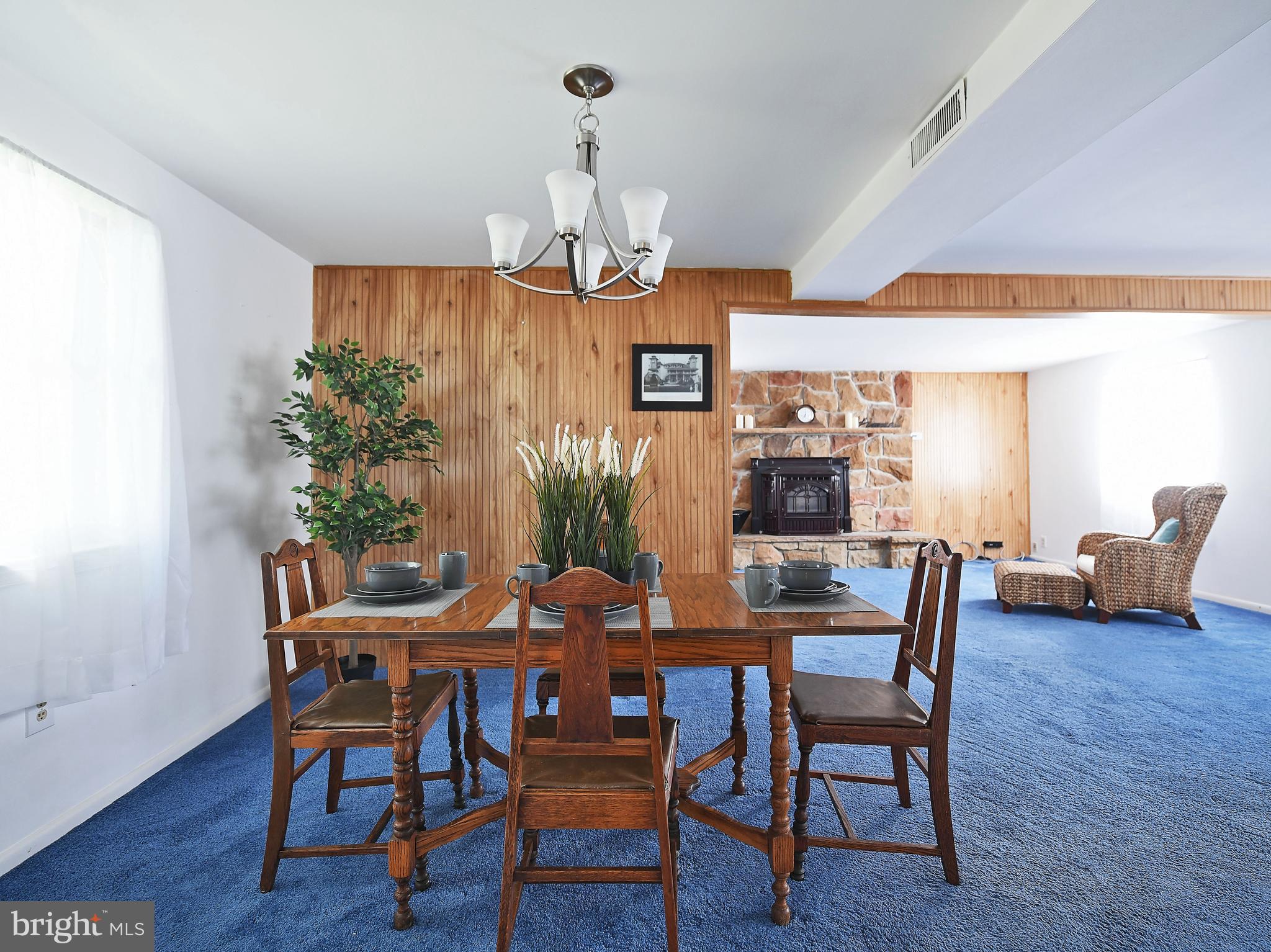 2400 Maple Road Baltimore, MD 21219 - Photo 9 of 45 a view of a dining room with furniture and wooden floor